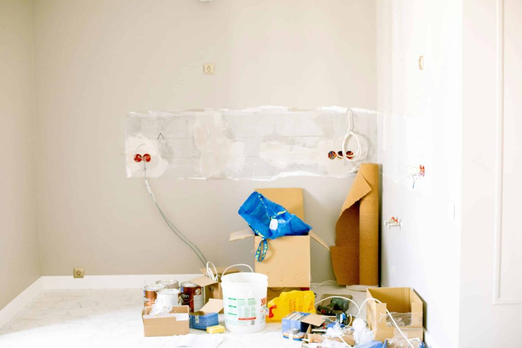 Messy room under renovation with supplies