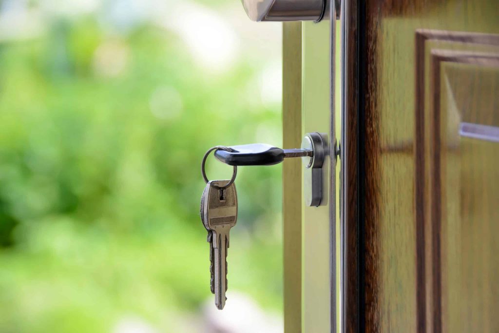 Key in door, inviting entry.